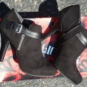 Black ankle high heeled booties